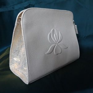 Cosmetic bag/Lotus White with gold. Never used.